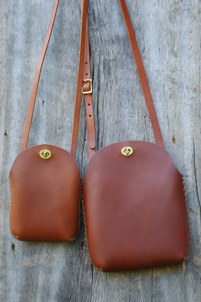 Brown minimalist leather purse with adjustable strap