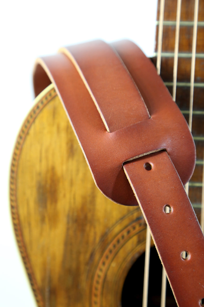 This guitar strap is a Tandy Leather kit that comes plain veg